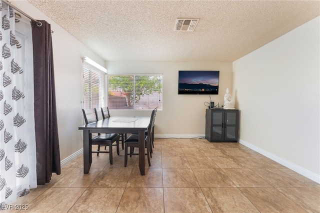 309 Clifton Heights Dr, Las Vegas, NV 89145 - dining space featuring a textured ceiling and light tile patterned floors