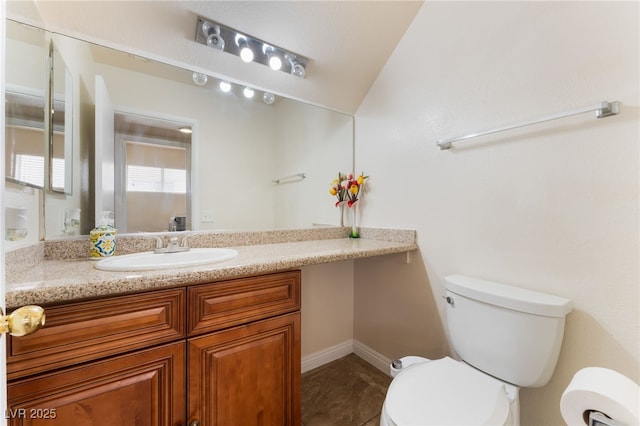 309 Clifton Heights Dr, Las Vegas, NV 89145 - bathroom featuring vanity and vaulted ceiling
