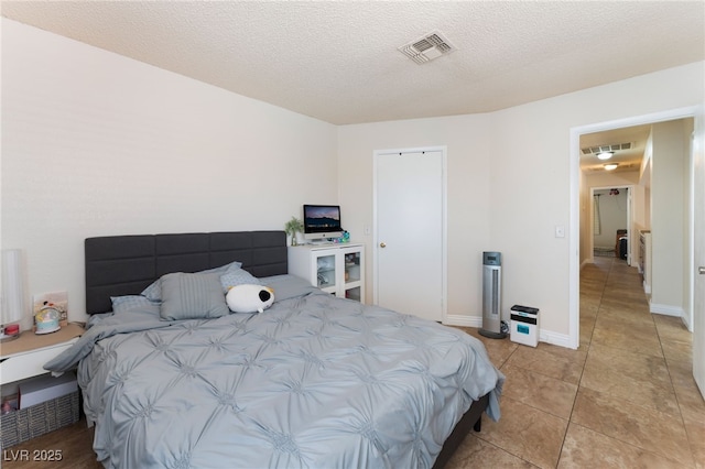 309 Clifton Heights Dr, Las Vegas, NV 89145 - bedroom featuring light tile patterned floors and a textured ceiling