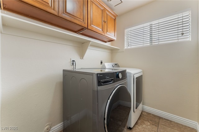 309 Clifton Heights Dr, Las Vegas, NV 89145 - laundry room with separate washer and dryer, cabinet space, and light tile patterned flooring