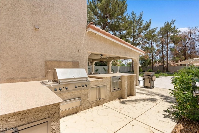 1990 Freeman Ct, Henderson, NV 89014 - fenced backyard with exterior kitchen and a patio area
