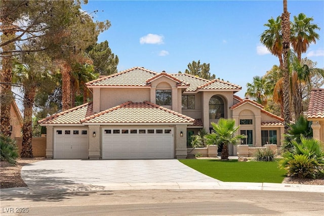 1990 Freeman Ct, Henderson, NV 89014 - mediterranean / spanish home with a garage, stucco siding, driveway, and a tile roof