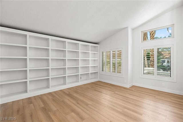 1990 Freeman Ct, Henderson, NV 89014 - unfurnished room with vaulted ceiling, a textured ceiling, and wood finished floors