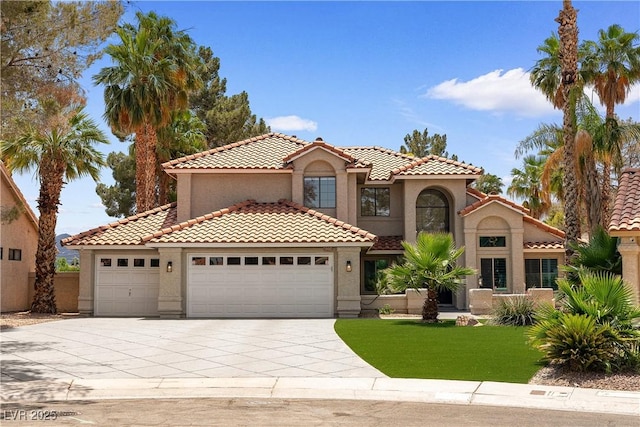 1990 Freeman Ct, Henderson, NV 89014 - mediterranean / spanish house with an attached garage, concrete driveway, and stucco siding