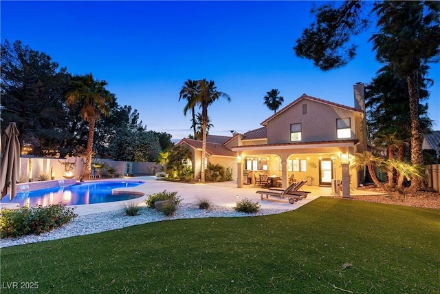1990 Freeman Ct, Henderson, NV 89014 - back of house with a patio area, stucco siding, a chimney, and a fenced backyard