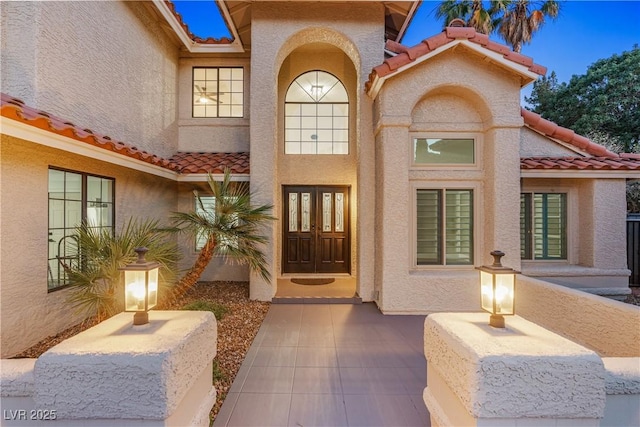 1990 Freeman Ct, Henderson, NV 89014 - property entrance with a tiled roof, stucco siding, and french doors