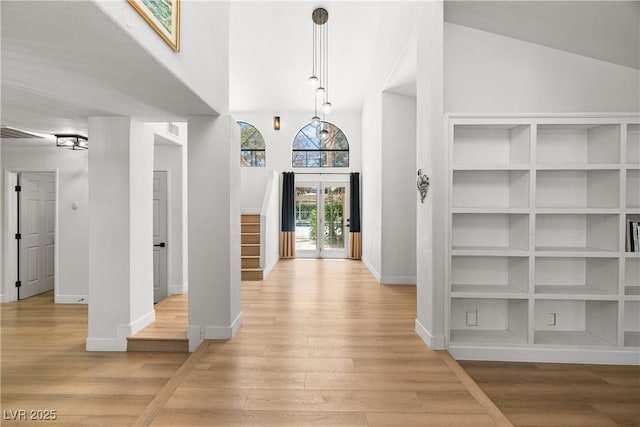 1990 Freeman Ct, Henderson, NV 89014 - foyer featuring light wood finished floors, stairs, and high vaulted ceiling