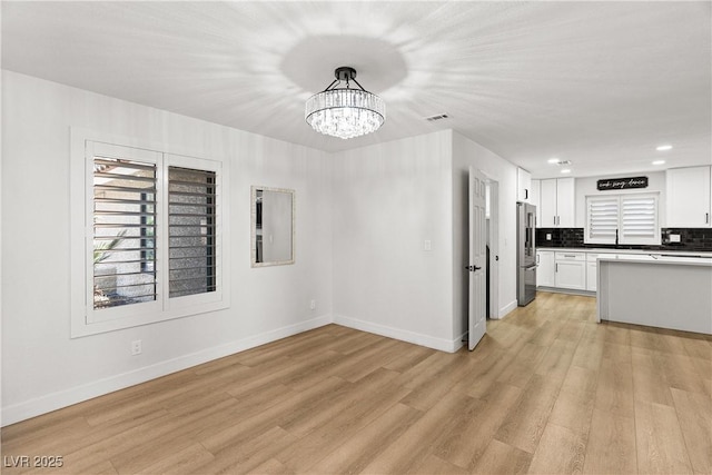 1990 Freeman Ct, Henderson, NV 89014 - unfurnished dining area featuring light wood-type flooring, a chandelier, and recessed lighting