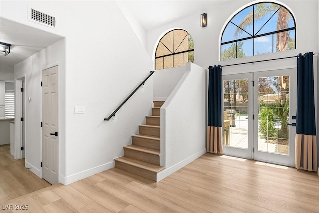 1990 Freeman Ct, Henderson, NV 89014 - foyer with wood finished floors, a high ceiling, and stairway