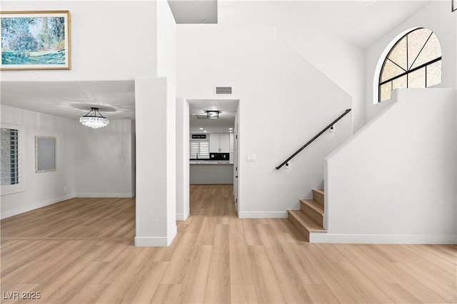 1990 Freeman Ct, Henderson, NV 89014 - entryway with a towering ceiling, light wood finished floors, plenty of natural light, and stairway