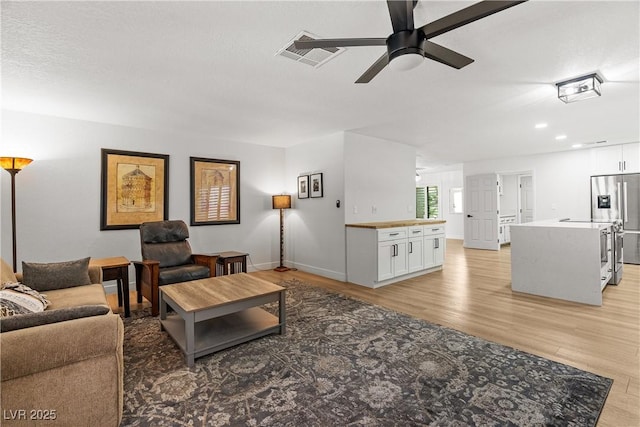 1990 Freeman Ct, Henderson, NV 89014 - living room featuring a ceiling fan, light wood-type flooring, and recessed lighting