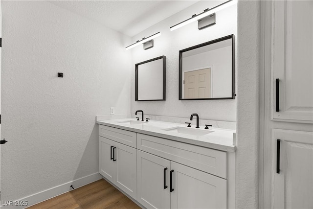 1990 Freeman Ct, Henderson, NV 89014 - bathroom with double vanity, wood finished floors, and a textured wall