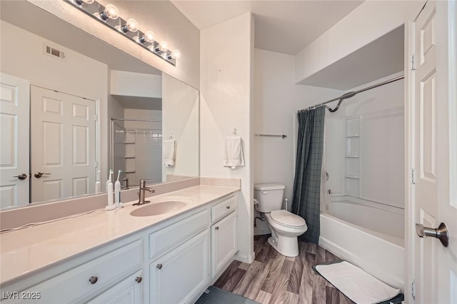7127 S Durango Dr Unit 310, Las Vegas, NV 89113 - bathroom with vanity, shower / bath combination with curtain, and wood finished floors