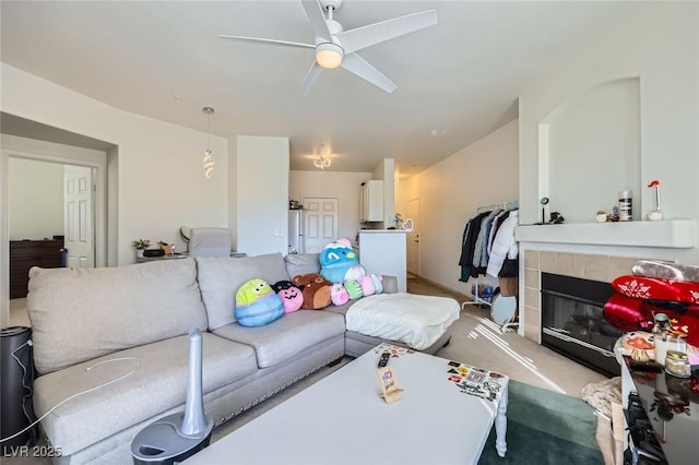 7127 S Durango Dr Unit 310, Las Vegas, NV 89113 - carpeted living area with a ceiling fan and a tile fireplace