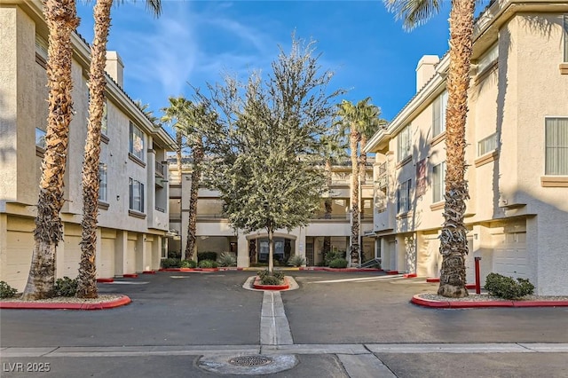 7127 S Durango Dr Unit 310, Las Vegas, NV 89113 - view of building exterior with a residential view