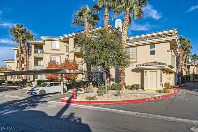 7127 S Durango Dr Unit 310, Las Vegas, NV 89113 - view of building exterior with covered parking