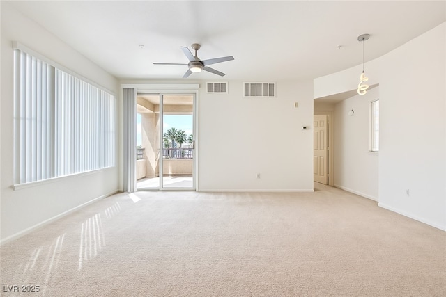 7127 S Durango Dr Unit 310, Las Vegas, NV 89113 - empty room with a ceiling fan and light colored carpet