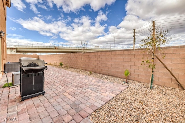 7948 Eastern Elk St, Las Vegas, NV 89149 - fenced backyard with a patio area and grilling area