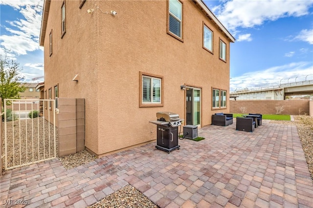 7948 Eastern Elk St, Las Vegas, NV 89149 - fenced backyard featuring an outdoor living space, a patio area, and a grill