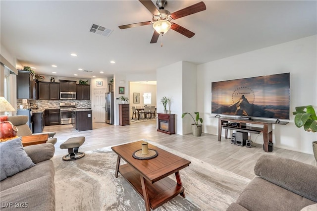 7948 Eastern Elk St, Las Vegas, NV 89149 - living room with a ceiling fan and recessed lighting