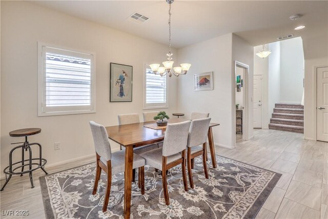 7948 Eastern Elk St, Las Vegas, NV 89149 - dining space featuring a chandelier and stairs