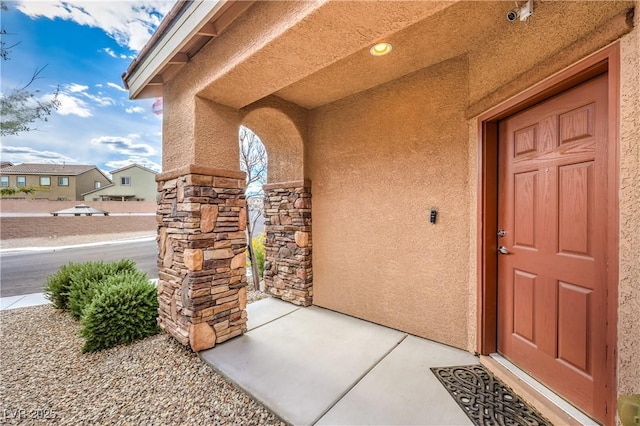 7948 Eastern Elk St, Las Vegas, NV 89149 - doorway to property with stucco siding and stone siding