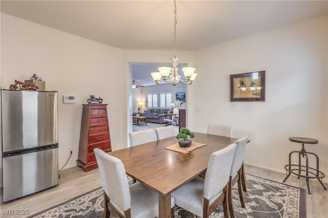 7948 Eastern Elk St, Las Vegas, NV 89149 - dining area with light wood finished floors and a chandelier