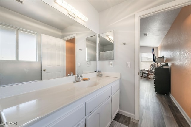 2230 Wagon Ave, Pahrump, NV 89048 - bathroom with wood finished floors and vanity