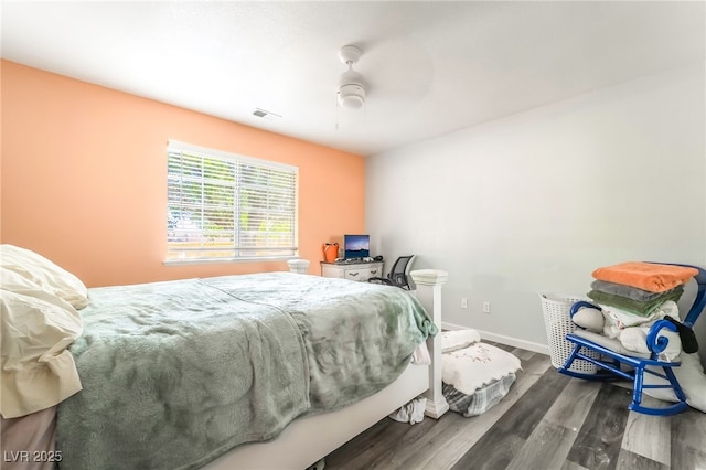 2230 Wagon Ave, Pahrump, NV 89048 - bedroom with wood finished floors and a ceiling fan
