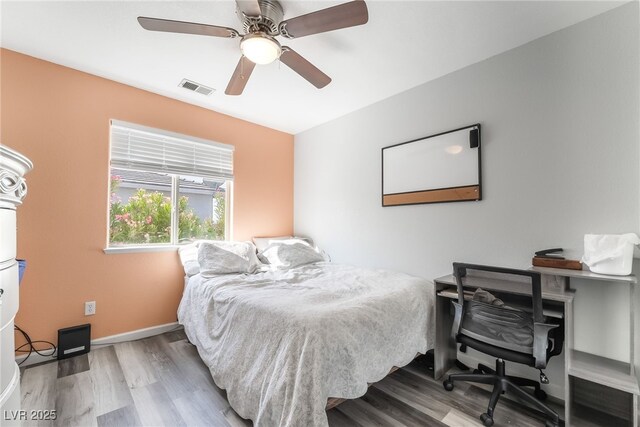 2230 Wagon Ave, Pahrump, NV 89048 - bedroom with wood finished floors and ceiling fan