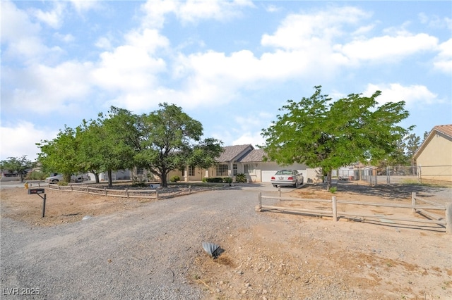 2230 Wagon Ave, Pahrump, NV 89048 - view of property hidden behind natural elements featuring driveway