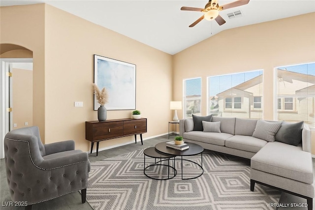 9338 Square Dance Pl Unit 101, Las Vegas, NV 89178 - living area featuring a ceiling fan, vaulted ceiling, and arched walkways