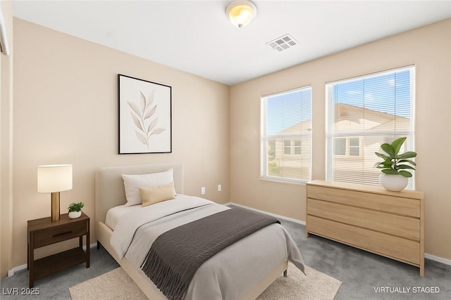 9338 Square Dance Pl Unit 101, Las Vegas, NV 89178 - bedroom with light colored carpet and baseboards