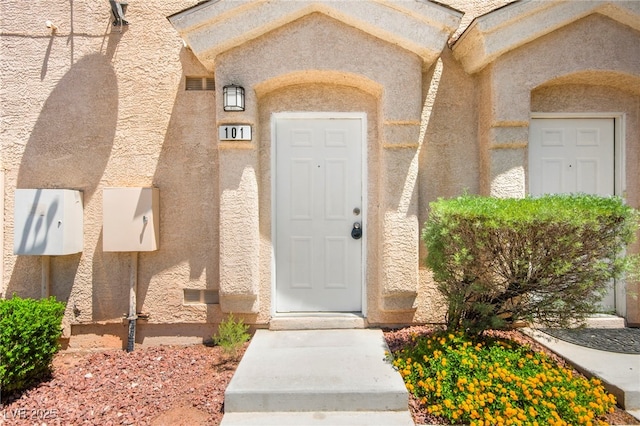 9338 Square Dance Pl Unit 101, Las Vegas, NV 89178 - view of exterior entry with stucco siding