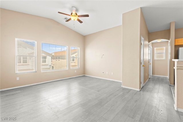 9338 Square Dance Pl Unit 101, Las Vegas, NV 89178 - spare room featuring a ceiling fan, light wood-type flooring, vaulted ceiling, and arched walkways
