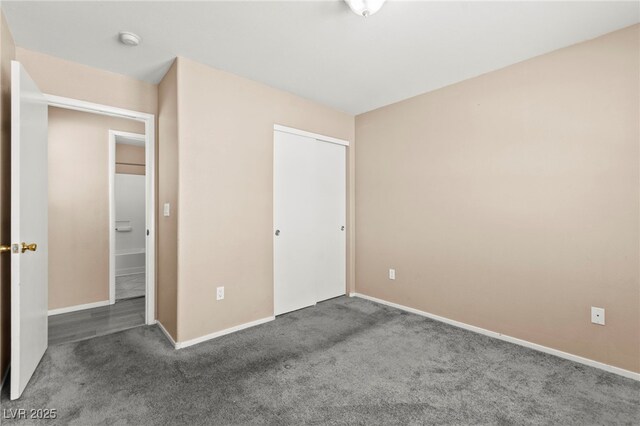 9338 Square Dance Pl Unit 101, Las Vegas, NV 89178 - unfurnished bedroom featuring carpet flooring and a closet