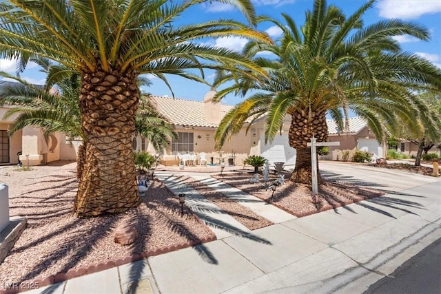 6292 Belgium Dr, Las Vegas, NV 89122 - view of front of house featuring stucco siding and a tile roof