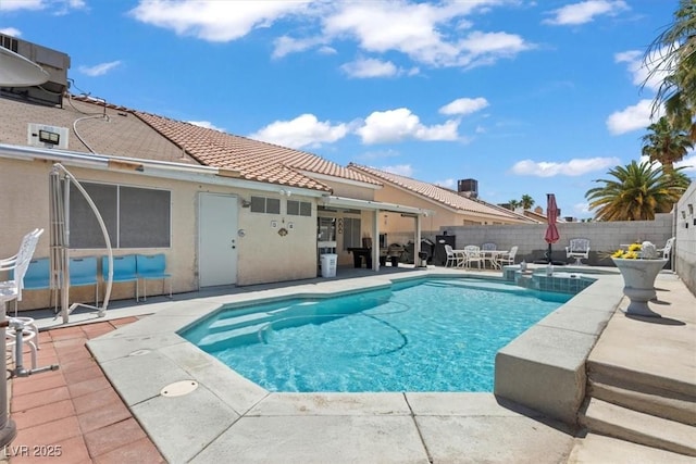 6292 Belgium Dr, Las Vegas, NV 89122 - view of swimming pool with a patio area, a fenced backyard, and a pool with connected hot tub
