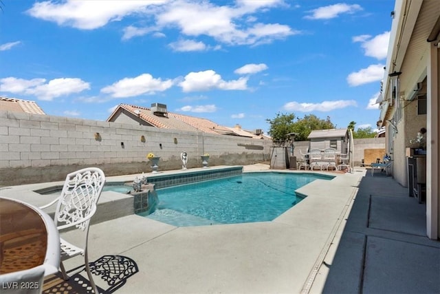 6292 Belgium Dr, Las Vegas, NV 89122 - view of pool featuring a patio, a pool with connected hot tub, and a fenced backyard