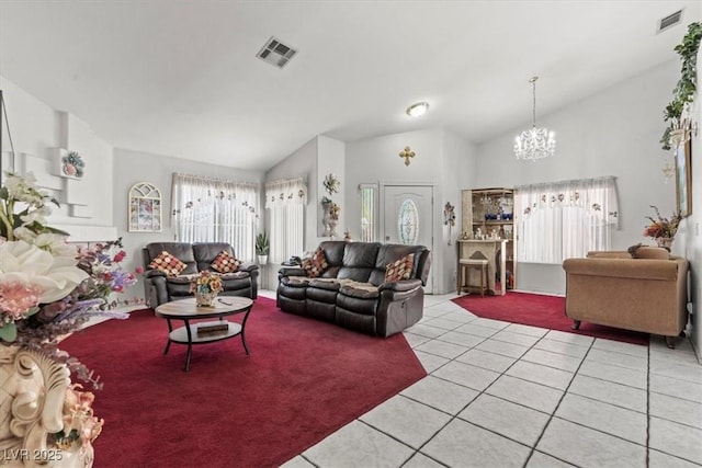 6292 Belgium Dr, Las Vegas, NV 89122 - living room featuring a chandelier, light tile patterned floors, and vaulted ceiling