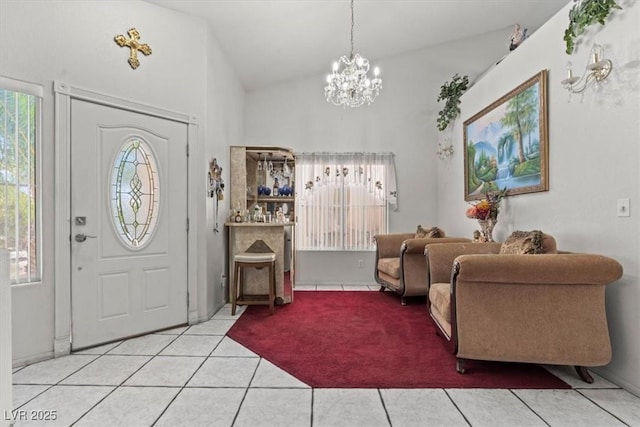 6292 Belgium Dr, Las Vegas, NV 89122 - entrance foyer featuring a chandelier, light tile patterned floors, and vaulted ceiling