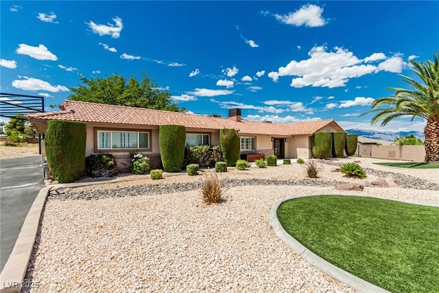9660 W Ann Rd, Las Vegas, NV 89149 - ranch-style house with stucco siding, a tile roof, and a chimney