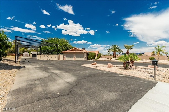 9660 W Ann Rd, Las Vegas, NV 89149 - view of front of home featuring an outbuilding and a carport