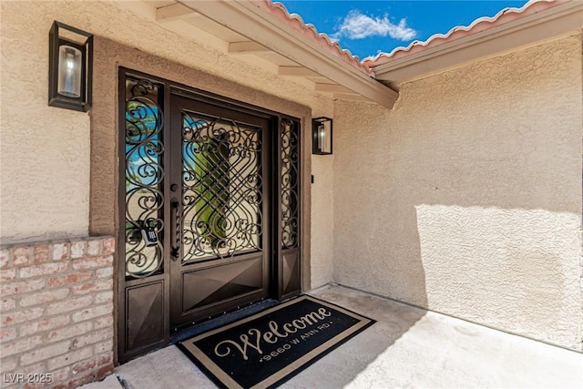 9660 W Ann Rd, Las Vegas, NV 89149 - entrance to property with stucco siding and a tiled roof
