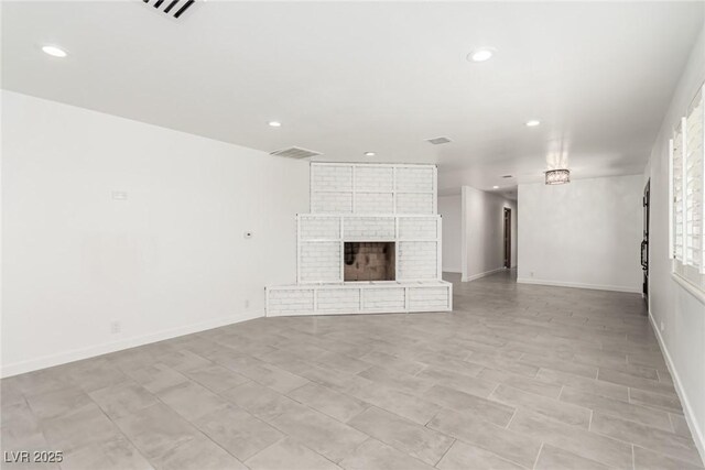 9660 W Ann Rd, Las Vegas, NV 89149 - unfurnished living room featuring recessed lighting and a brick fireplace