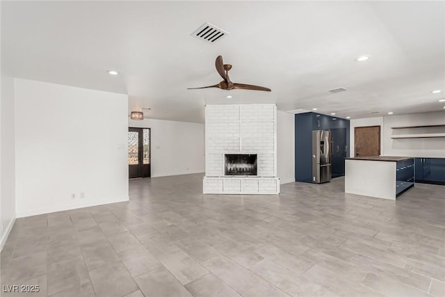 9660 W Ann Rd, Las Vegas, NV 89149 - unfurnished living room with ceiling fan, recessed lighting, and a fireplace