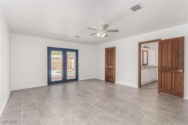 9660 W Ann Rd, Las Vegas, NV 89149 - unfurnished room featuring french doors and a ceiling fan