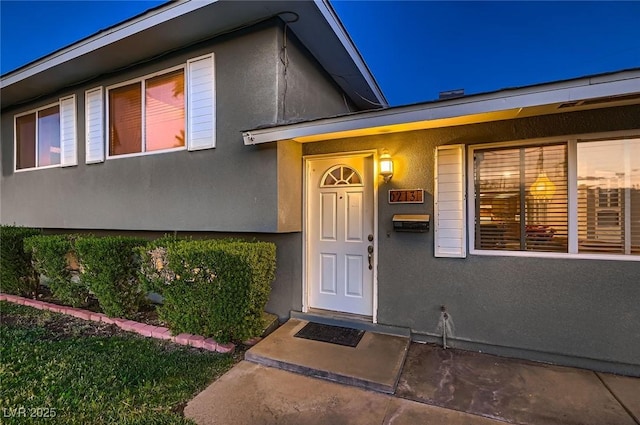 6213 Fairwood Ave, Las Vegas, NV 89107 - doorway to property with stucco siding