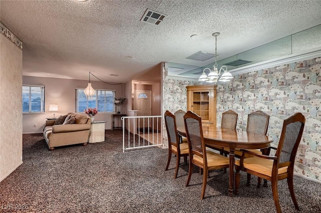 6213 Fairwood Ave, Las Vegas, NV 89107 - dining space featuring carpet floors, a chandelier, and a textured ceiling