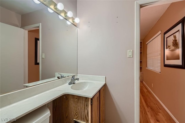6213 Fairwood Ave, Las Vegas, NV 89107 - bathroom with wood finished floors and vanity